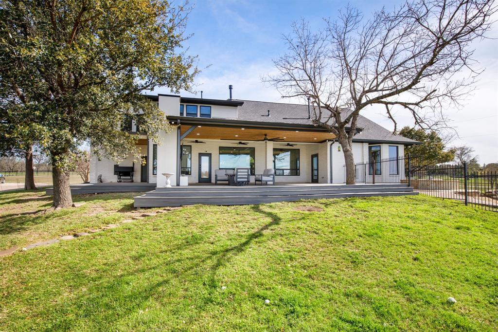 245 Barnes Bridge Road Sunnyvale, TX 75182 - Photo 34 of 40 The deck wraps around to the perfect staging area for grilling or smoking (smoker not included). There's also access to the garage through a side garage door.