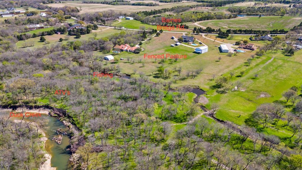 245 Barnes Bridge Road Sunnyvale, TX 75182 - Photo 39 of 40 An outdoor enthusiast’s dream across six sprawling acres. Spend your days fishing in one of the two creeks or exploring on ATVs, and your evenings entertaining by the pool and hot tub. Equipped for ranch life with a functional barn and fenced pasture for horses and livestock.