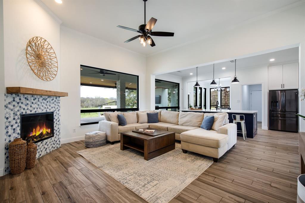 245 Barnes Bridge Road Sunnyvale, TX 75182 - Photo 8 of 40 Wood type tile is consistent throughout the first floor.