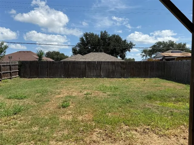 a view of a back yard of a house