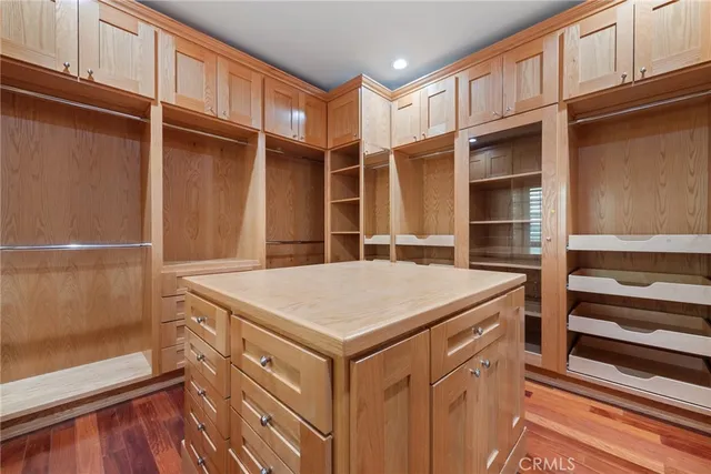 an empty room with wooden floor