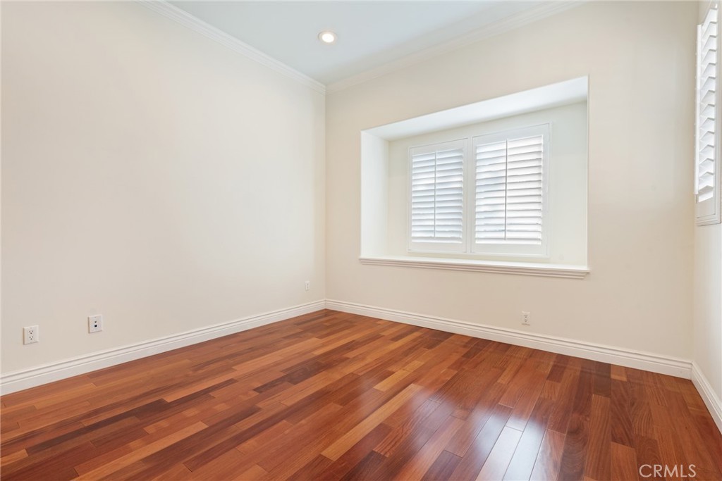21819 Chestnut Court Walnut, CA 91789 - Photo 22 of 32 an empty room with wooden floor and windows