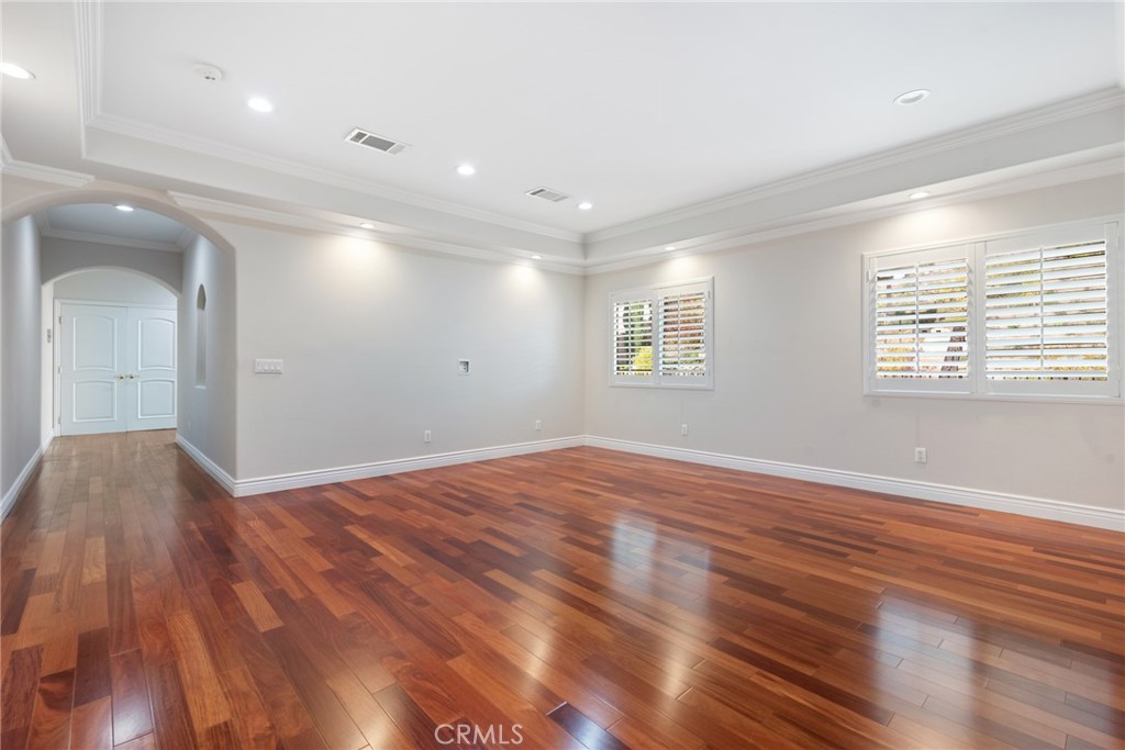 21819 Chestnut Court Walnut, CA 91789 - Photo 25 of 32 an empty room with wooden floor and windows