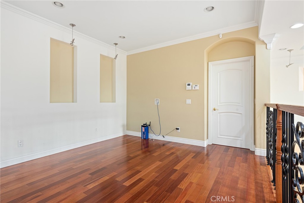 21819 Chestnut Court Walnut, CA 91789 - Photo 30 of 32 a view of empty room with wooden floor