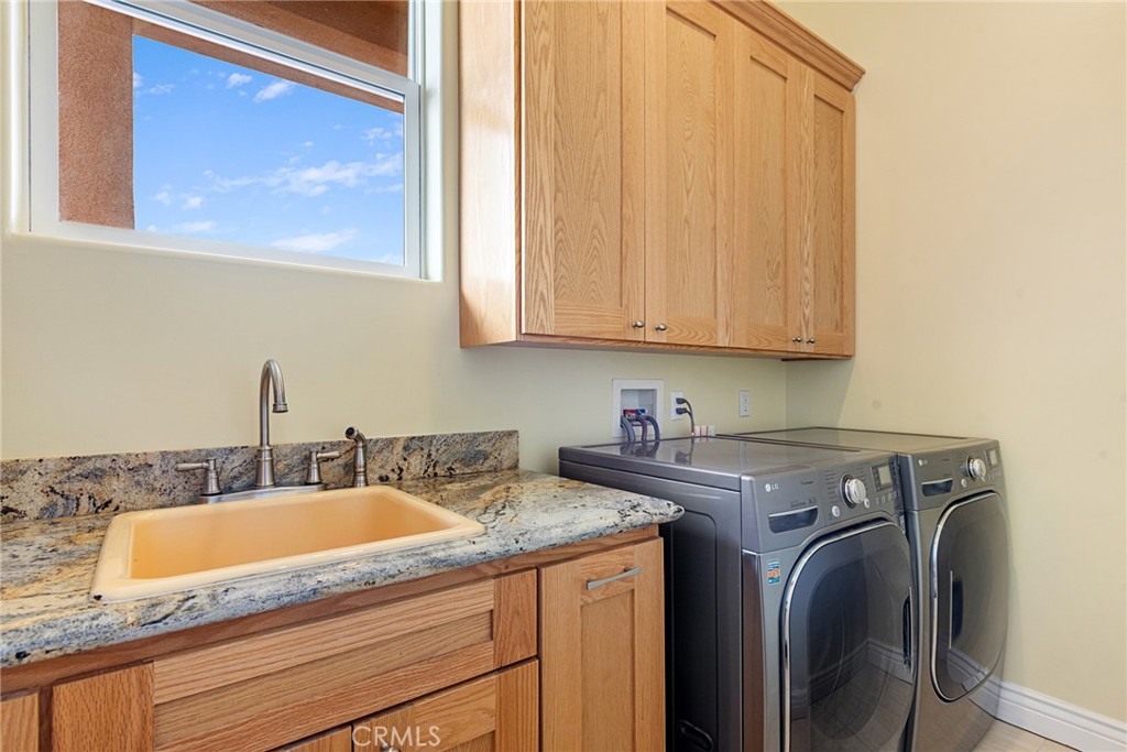 21819 Chestnut Court Walnut, CA 91789 - Photo 31 of 32 a view of a sink and washer dryer