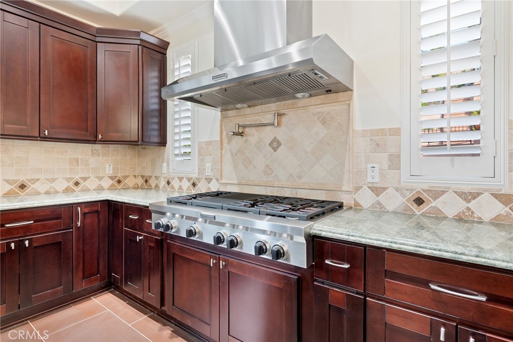 21819 Chestnut Court Walnut, CA 91789 - Photo 8 of 32 a kitchen with granite countertop a sink stove and cabinets