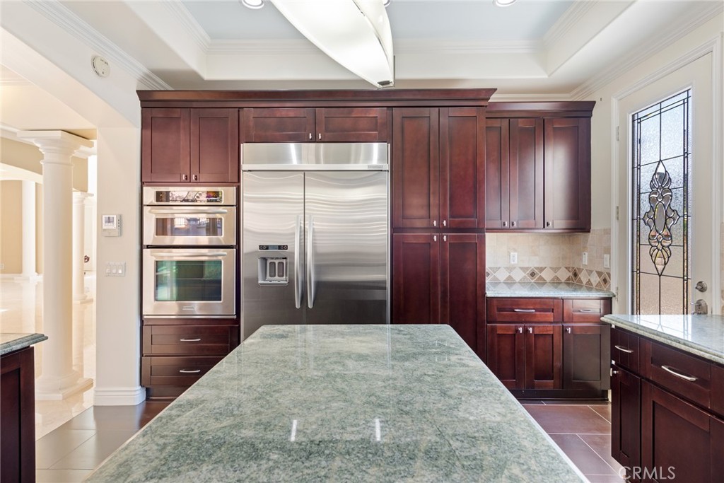 21819 Chestnut Court Walnut, CA 91789 - Photo 9 of 32 a kitchen with stainless steel appliances granite countertop a refrigerator and a sink