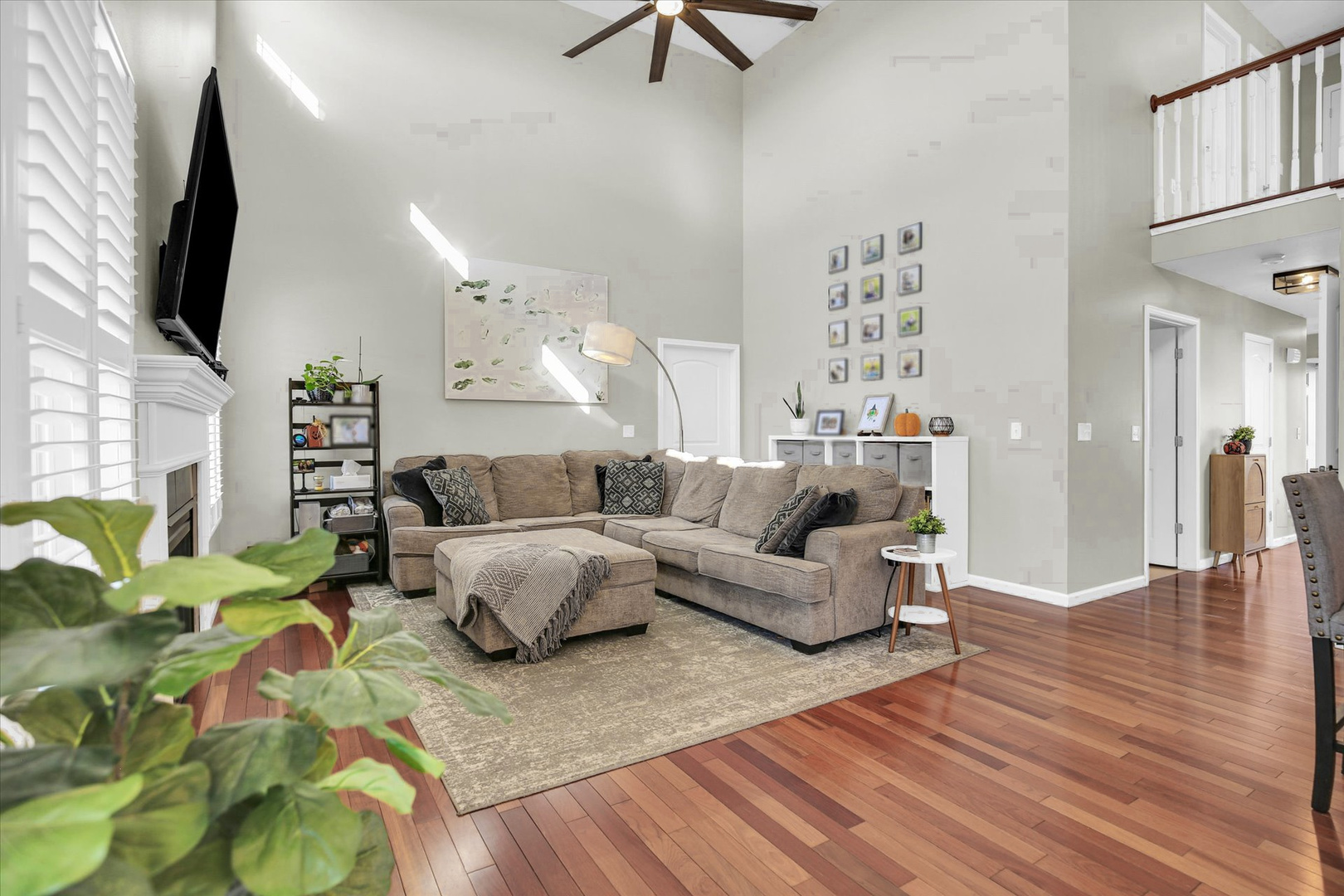 1315 West Ridge Lane Champaign, IL 61822 - Photo 33 of 102 a living room with furniture wooden floor and a flat screen tv