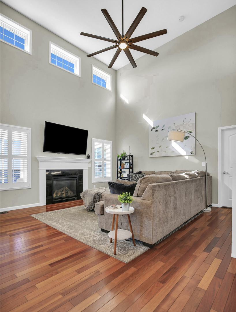 1315 West Ridge Lane Champaign, IL 61822 - Photo 35 of 102 a living room with furniture and a fireplace
