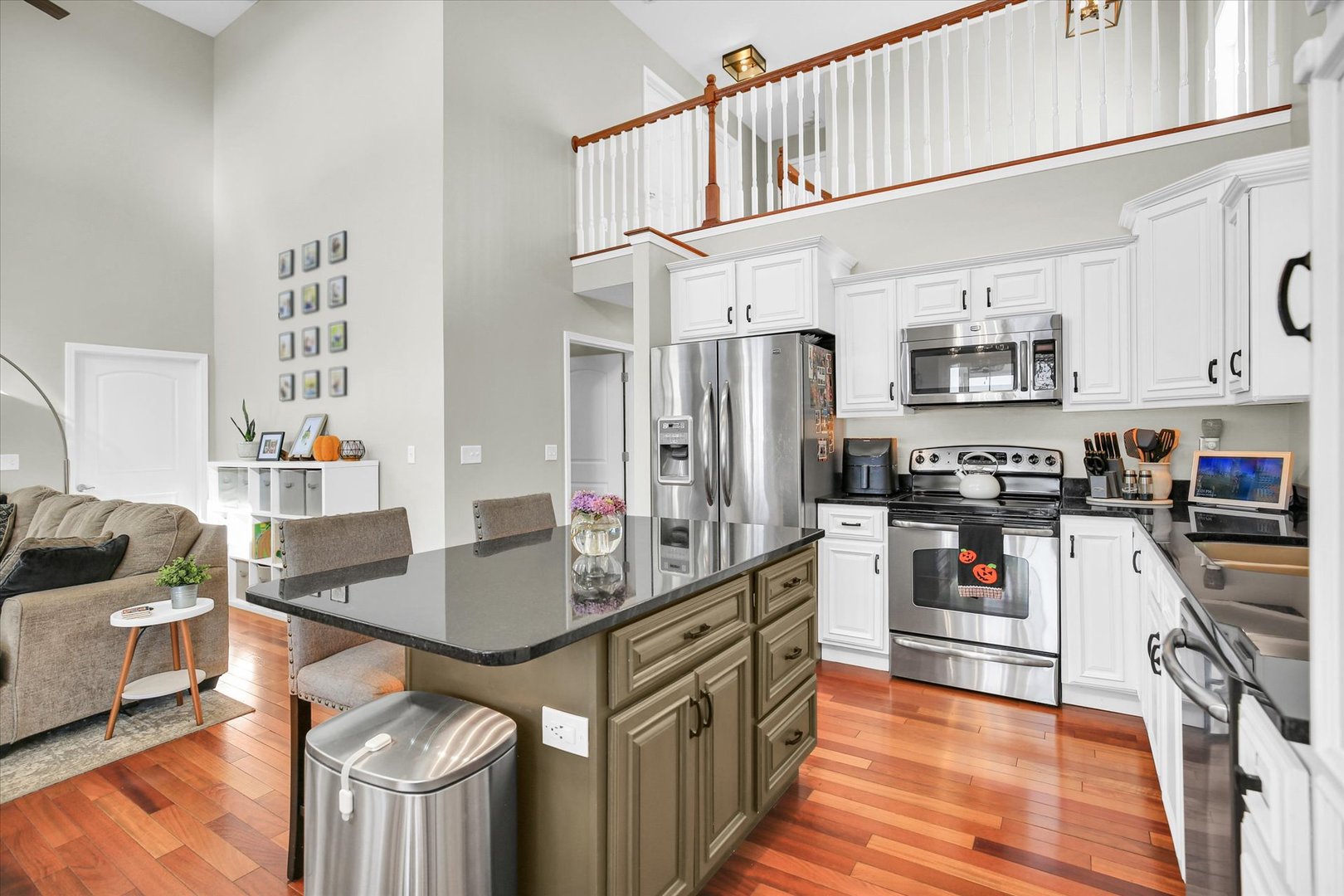 1315 West Ridge Lane Champaign, IL 61822 - Photo 45 of 102 a kitchen with stainless steel appliances granite countertop a sink stove and refrigerator