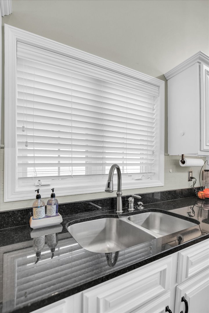 1315 West Ridge Lane Champaign, IL 61822 - Photo 51 of 102 a kitchen with a sink cabinets and window