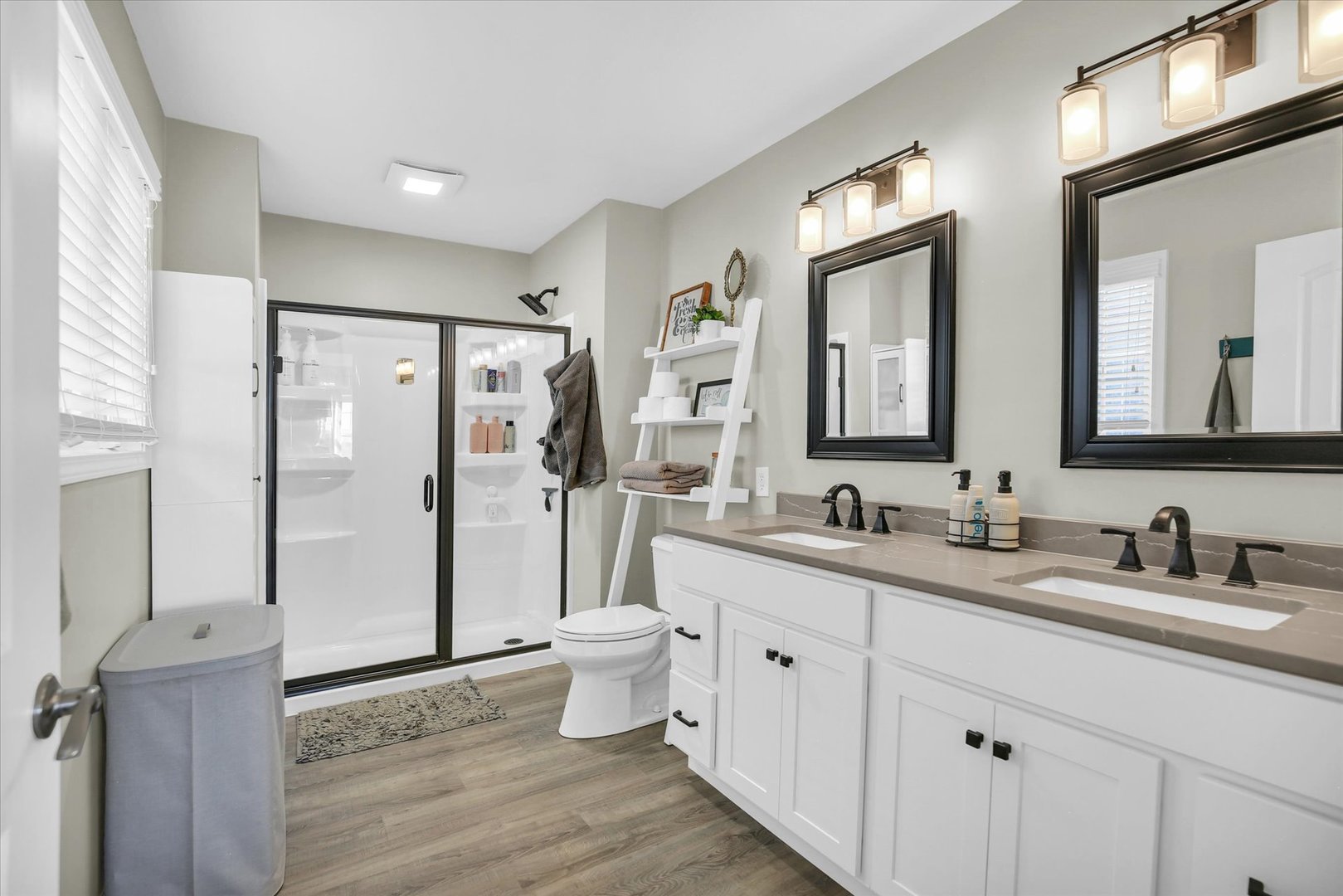 1315 West Ridge Lane Champaign, IL 61822 - Photo 60 of 102 a bathroom with a double vanity sink mirror and toilet