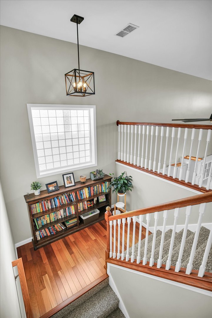 1315 West Ridge Lane Champaign, IL 61822 - Photo 69 of 102 a bed sitting in a bedroom next to a window