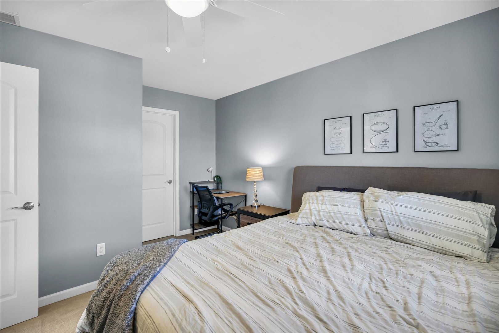 1315 West Ridge Lane Champaign, IL 61822 - Photo 70 of 102 a bedroom with a bed and a lamp