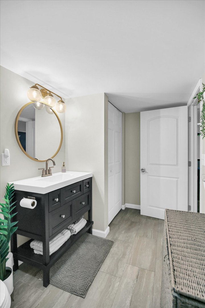 1315 West Ridge Lane Champaign, IL 61822 - Photo 87 of 102 a room with a mirror and double vanity