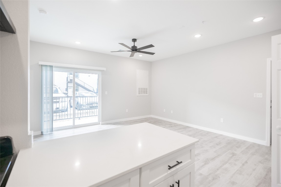 2101 Reinke Road, Unit 3203 Waller, TX 77484 - Photo 7 of 20 an empty room with windows and ceiling fan