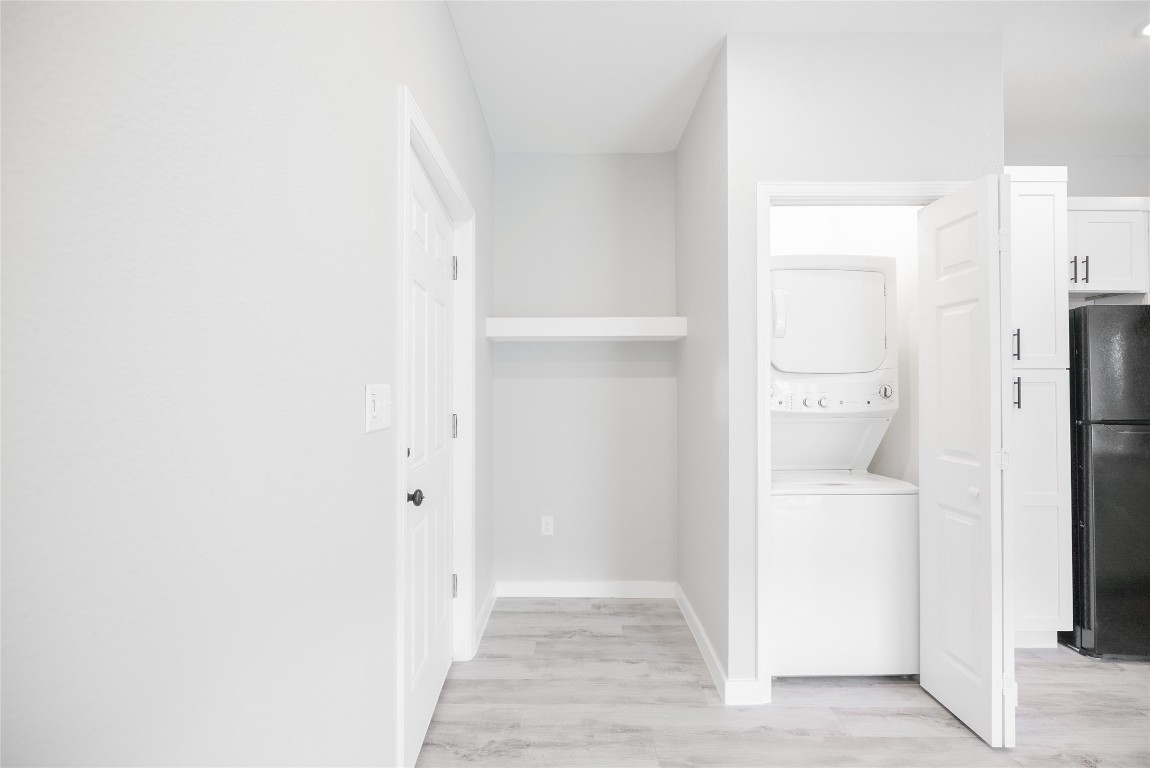 2101 Reinke Road, Unit 3203 Waller, TX 77484 - Photo 8 of 20 a view of a hallway with a white cabinet and a door