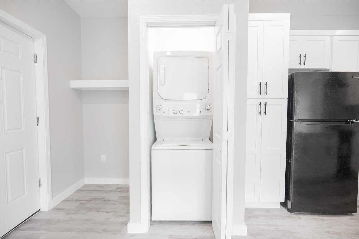 2101 Reinke Road, Unit 3203 Waller, TX 77484 - Photo 9 of 20 a kitchen with a refrigerator and cabinets