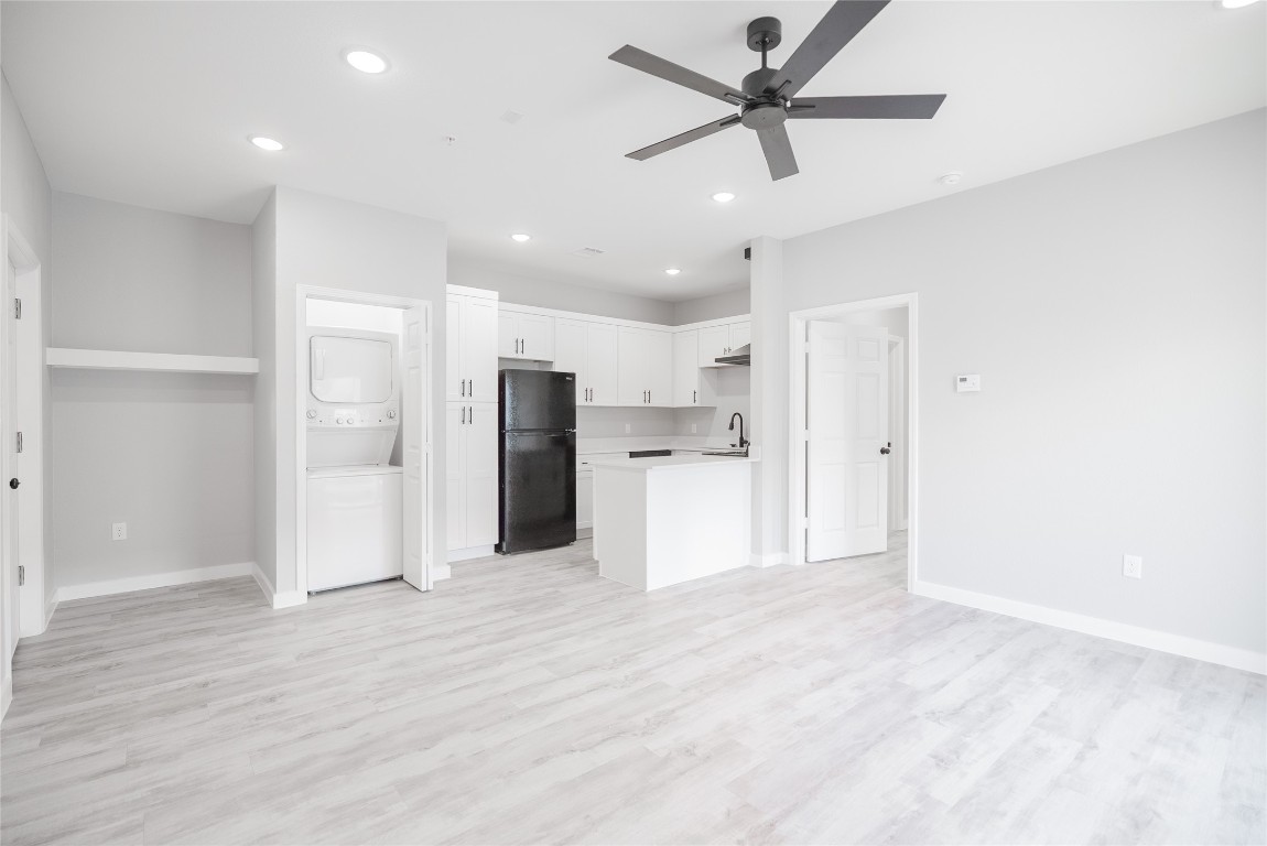 2101 Reinke Road, Unit 3203 Waller, TX 77484 - Photo 10 of 20 a view of a kitchen with a refrigerator and a sink