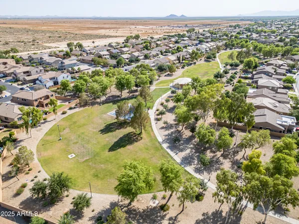 an aerial view of residential houses with outdoor space