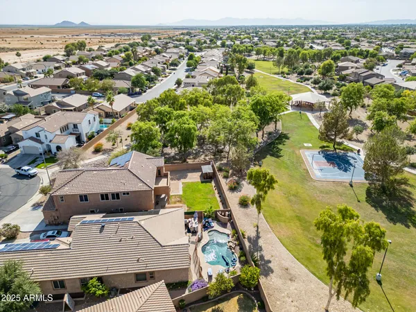 an aerial view of residential houses with outdoor space