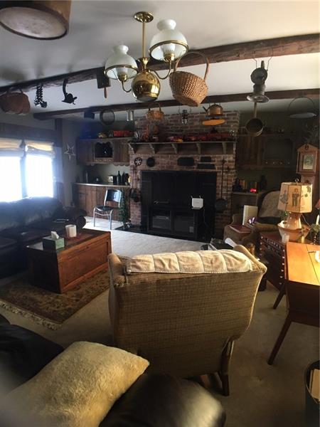 152 McKean Road Freeport, PA 16229 - Photo 21 of 23 Living room-see big fireplace-doors to upper patio on left
