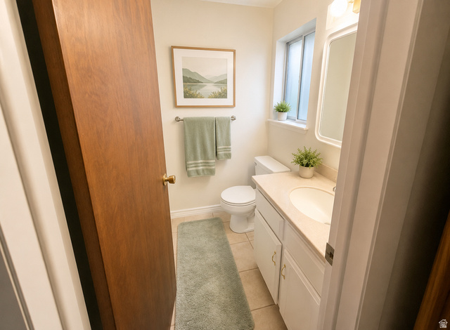 1020 Wilmar Place Centerville, UT 84014 - Photo 8 of 22 Bathroom featuring a single vanity with built-in cabinetry, an integrated sink, and a framed mirror