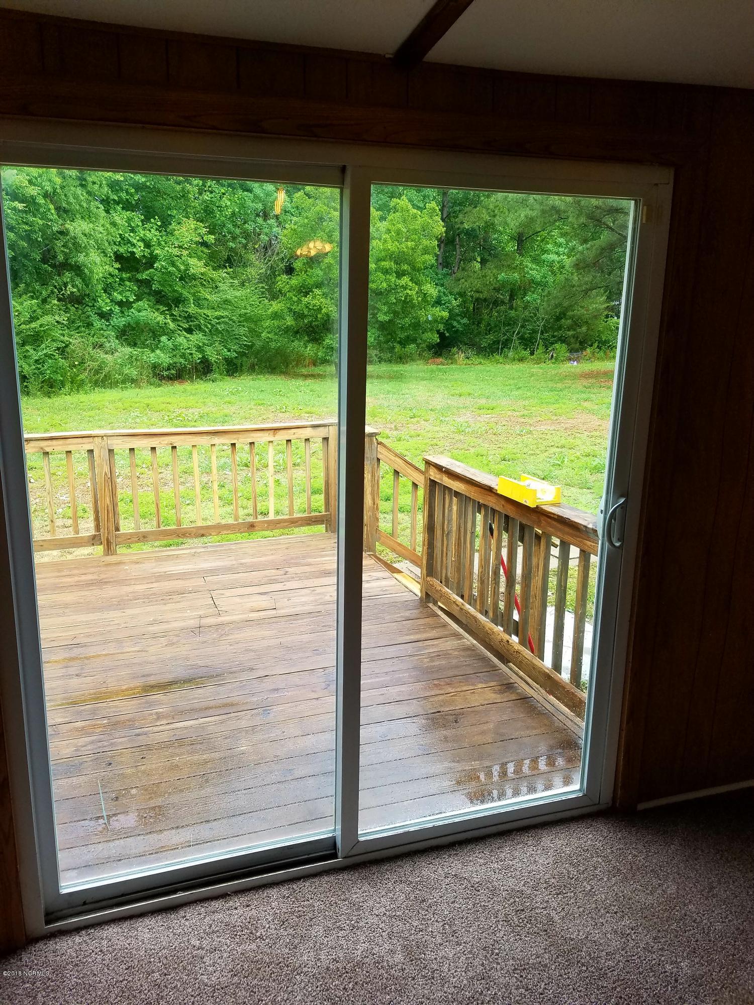 501 East Henry Street Atkinson, NC 28421 - Photo 20 of 34 deck from dining area