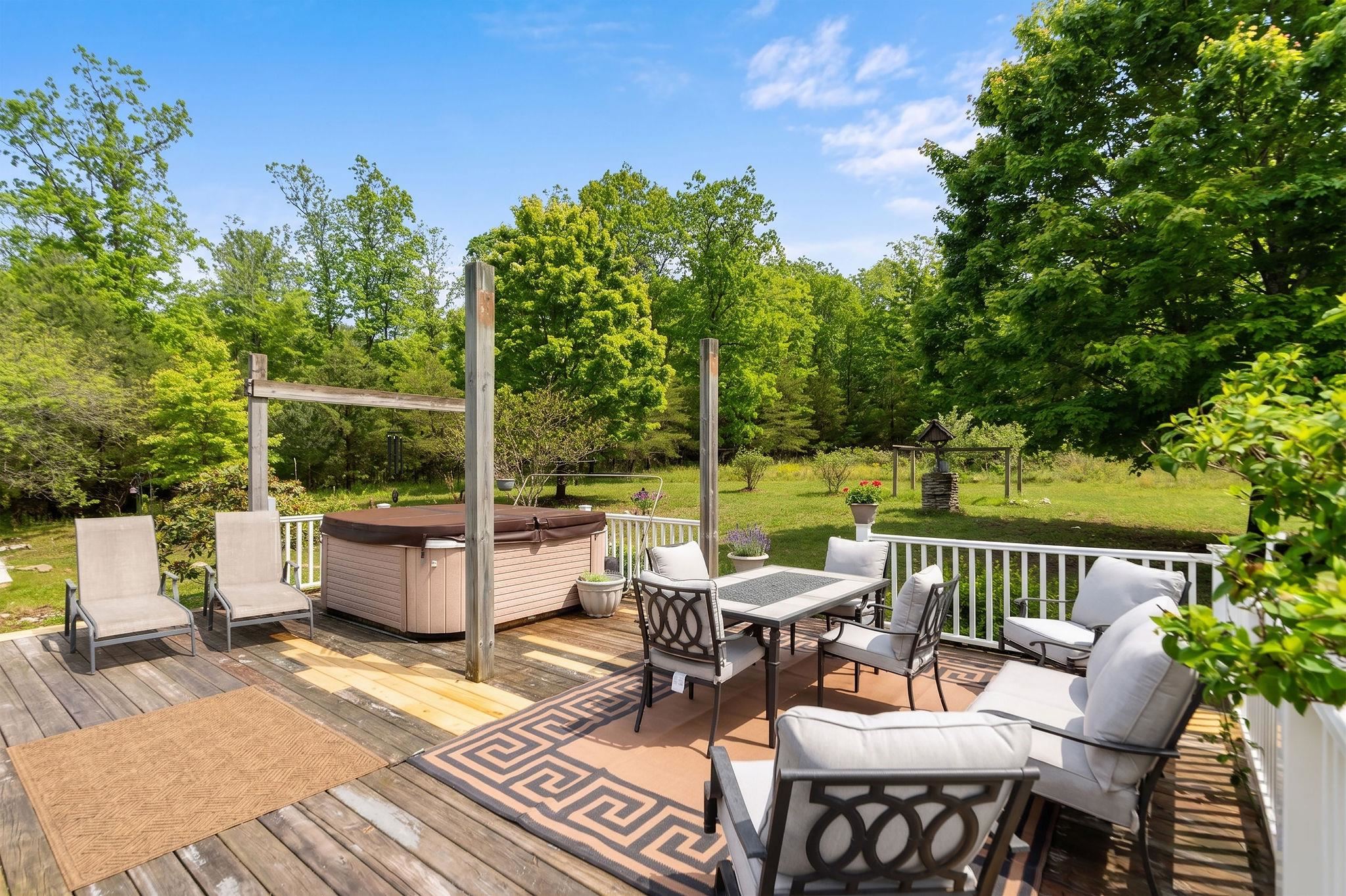 516 Estaline Valley Road Craigsville, VA 24430 - Photo 65 of 75 a view of a patio with couches potted plants and a large tree
