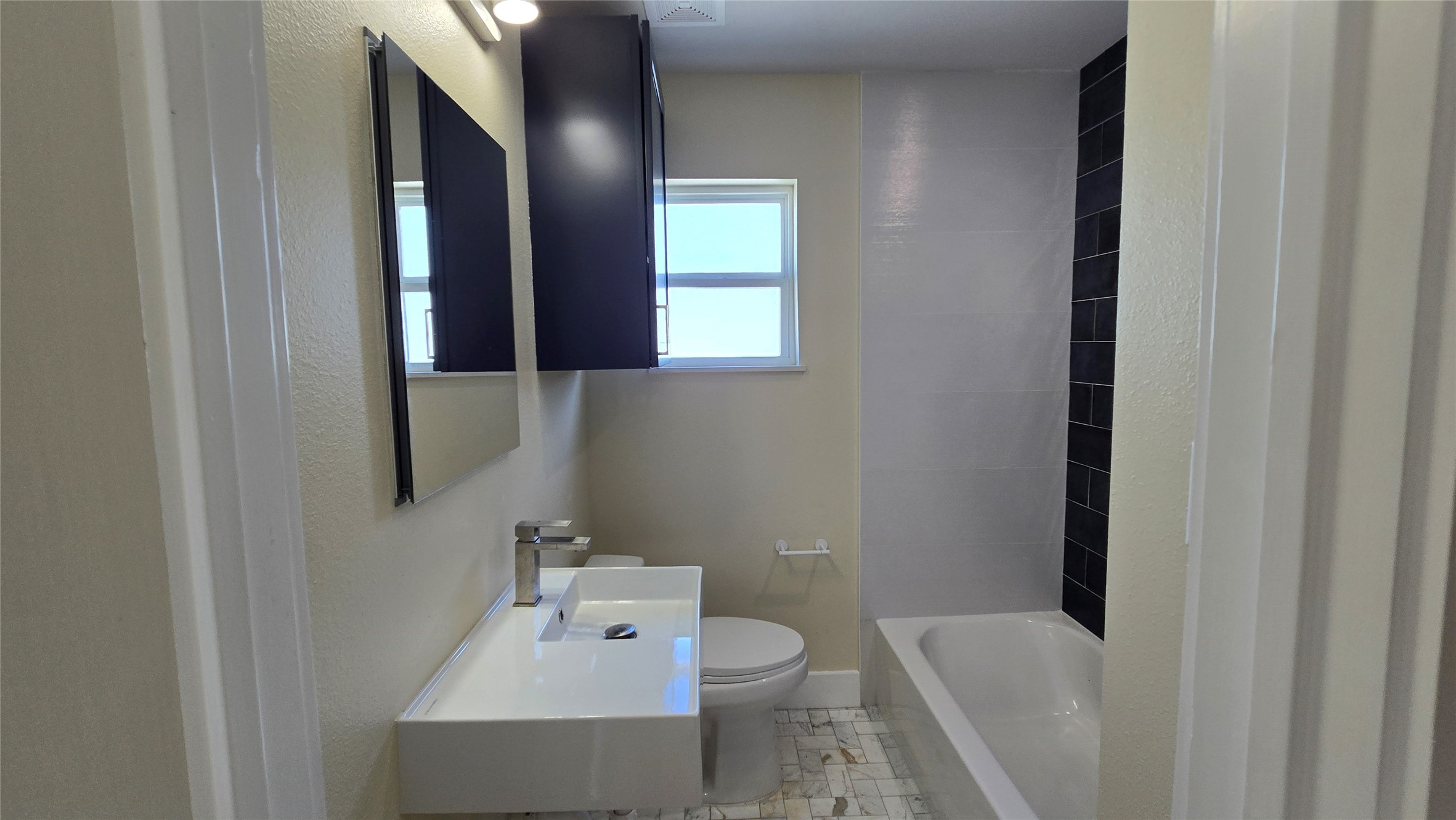 3741 Seabrook Street Houston, TX 77021 - Photo 19 of 50 a bathroom with a sink toilet and mirror