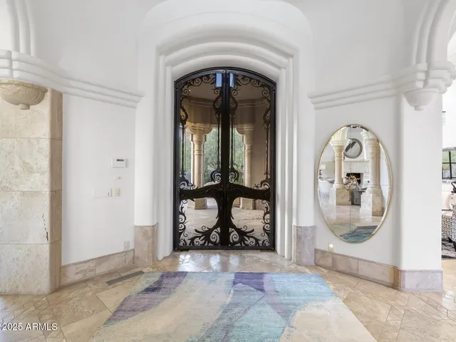 a view of a chairs and table in patio
