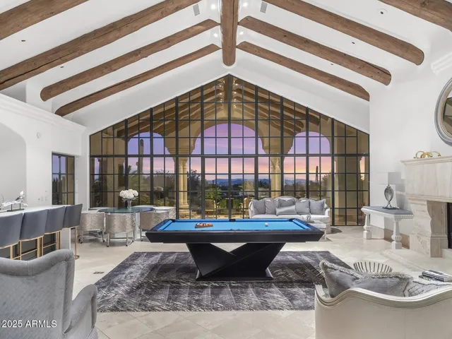 a living room with fireplace furniture and a flat screen tv