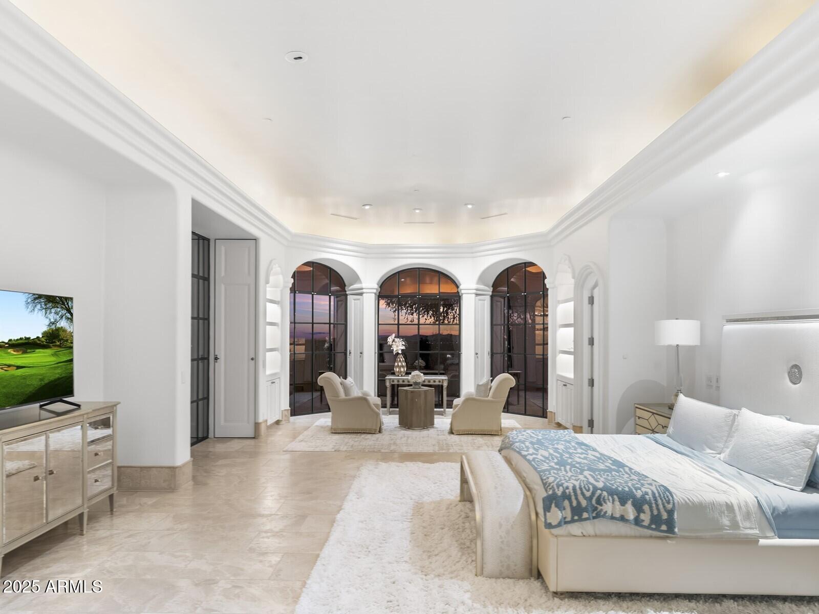 9422 East Happy Valley Road Scottsdale, AZ 85255 - Photo 28 of 78 a living room with furniture a flat screen tv and a large window