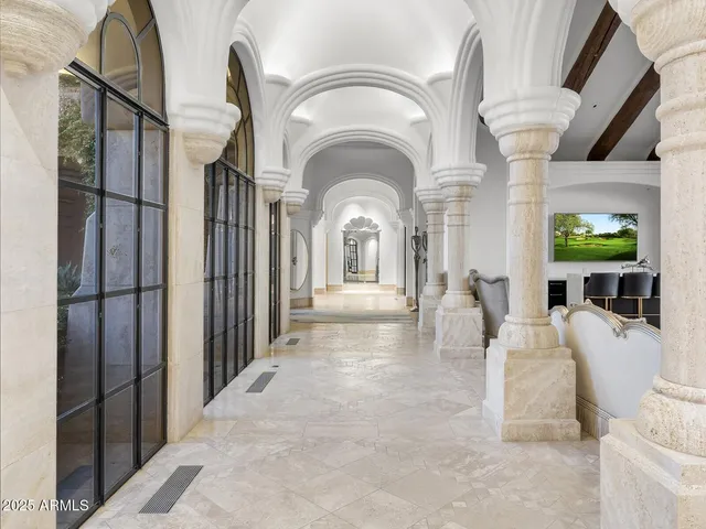 a spacious bathroom with a double vanity sink a mirror and a bathtub