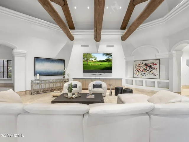 a spacious bathroom with a double vanity sink mirror and toilet