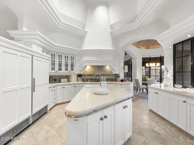 a bedroom with furniture and a fireplace