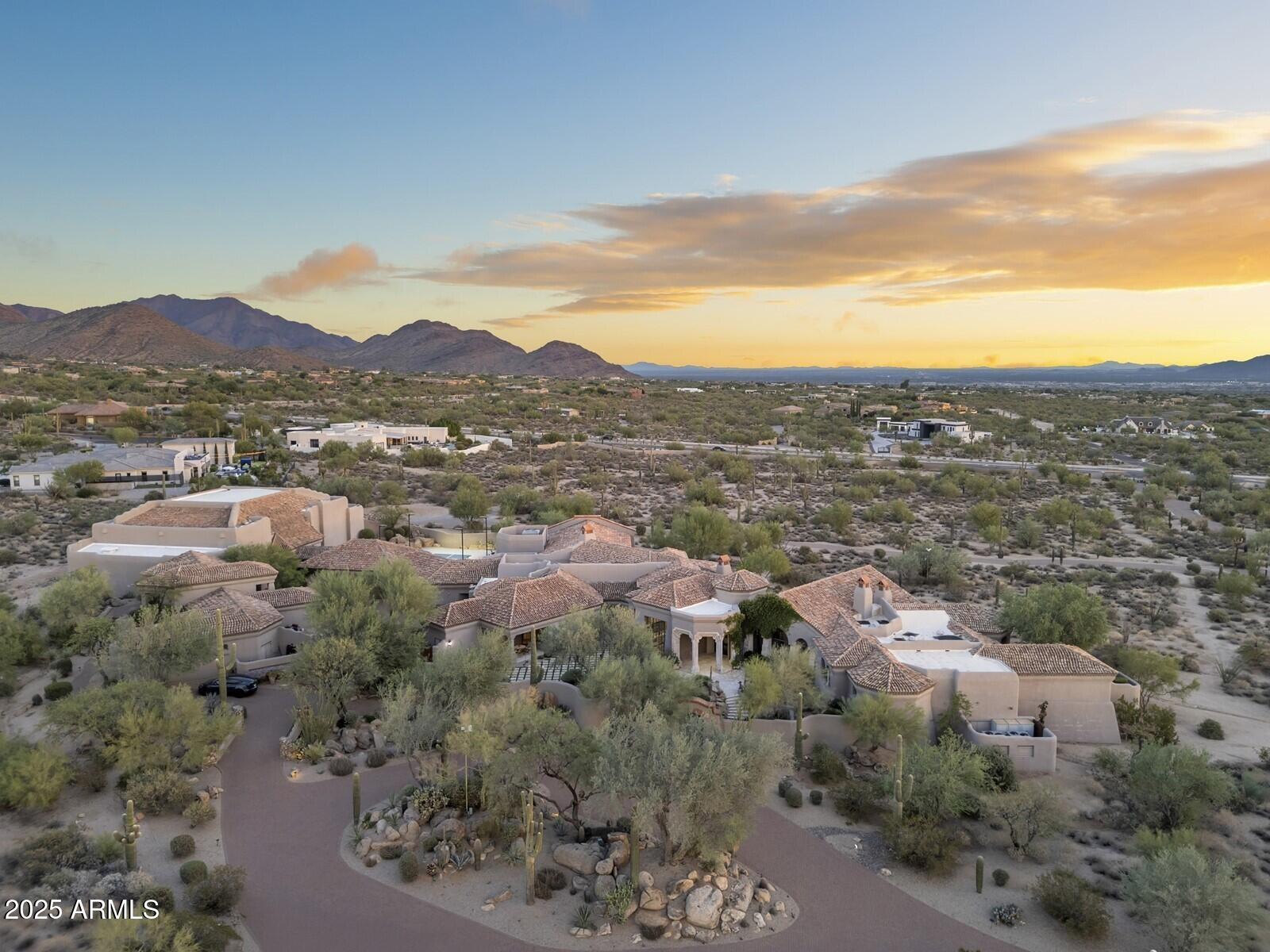 9422 East Happy Valley Road Scottsdale, AZ 85255 - Photo 3 of 99 a view of a city with mountains in the background