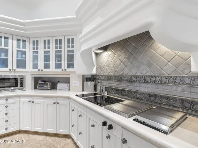 a bed room with a bed and a chair