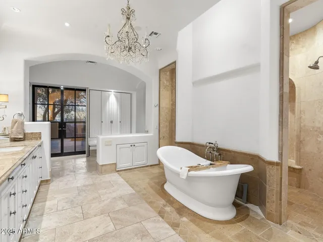 a view of a patio with couches chairs and potted plants