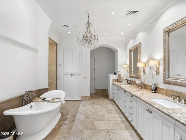 a view of a terrace with couches and wooden fence