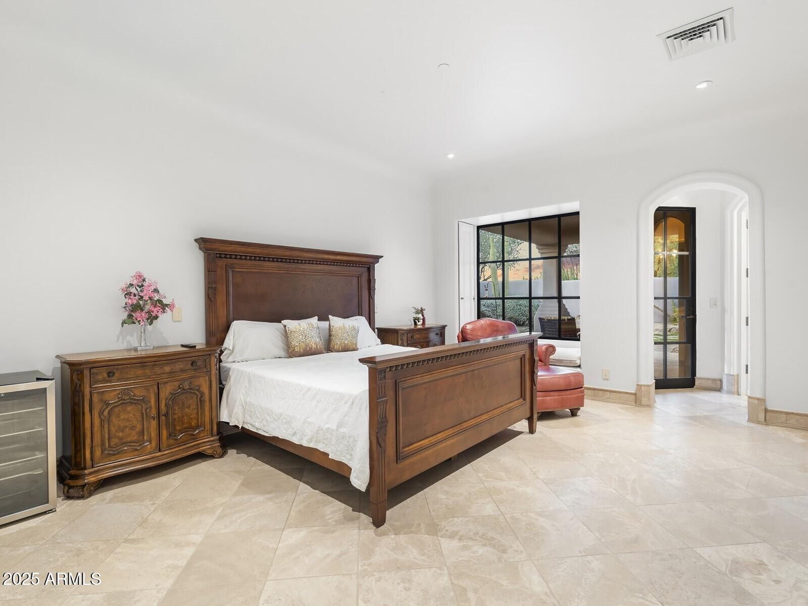 9422 East Happy Valley Road Scottsdale, AZ 85255 - Photo 59 of 99 a bed room with a bed and a chair