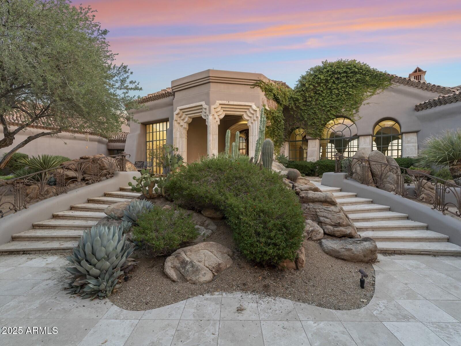 9422 East Happy Valley Road Scottsdale, AZ 85255 - Photo 5 of 78 a front view of a house with a yard