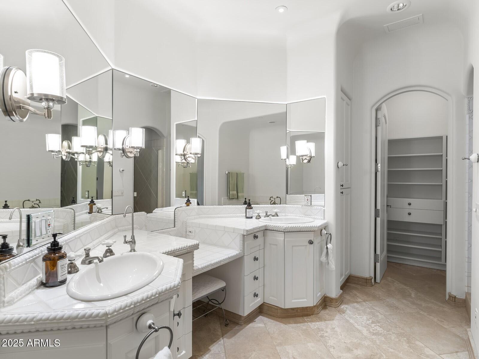 9422 East Happy Valley Road Scottsdale, AZ 85255 - Photo 64 of 99 a bathroom with a sink double vanity and a mirror