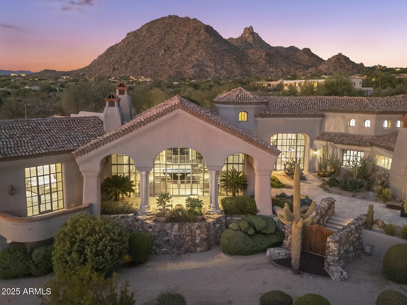 9422 East Happy Valley Road Scottsdale, AZ 85255 - Photo 74 of 78 a front view of a house with a yard