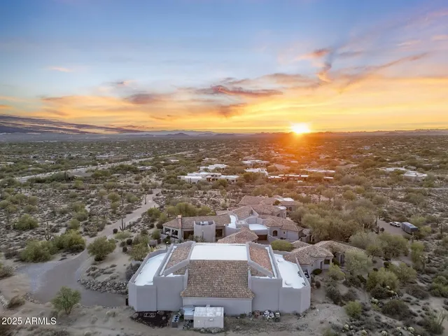 a view of a town with mountains in the background