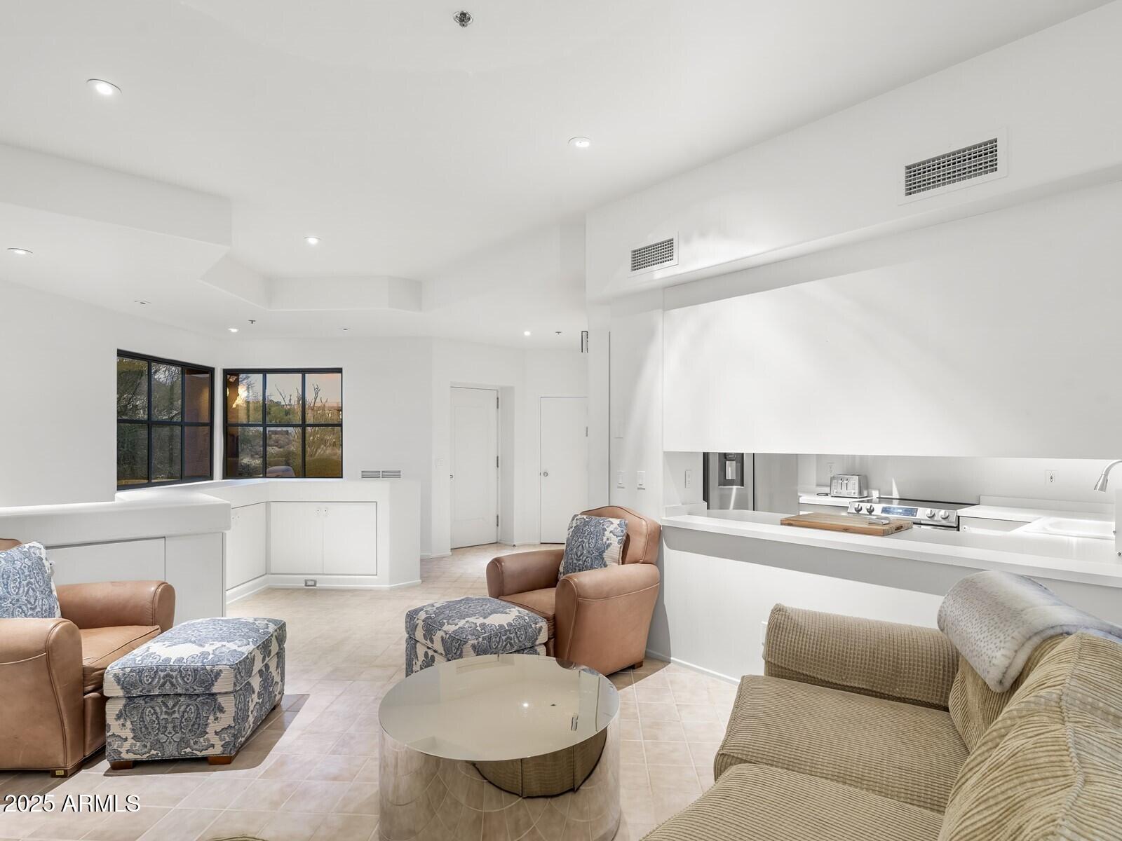 9422 East Happy Valley Road Scottsdale, AZ 85255 - Photo 93 of 99 a living room with furniture and a large window
