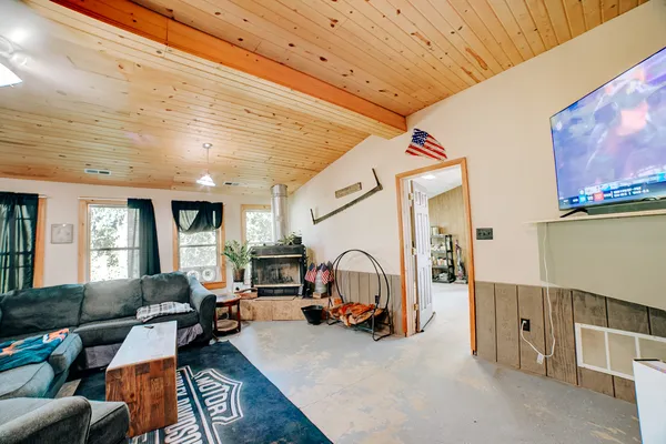 a view of a livingroom with furniture and windows
