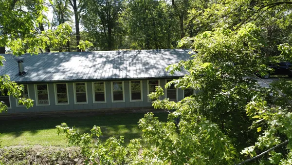 front view of a house with a garden