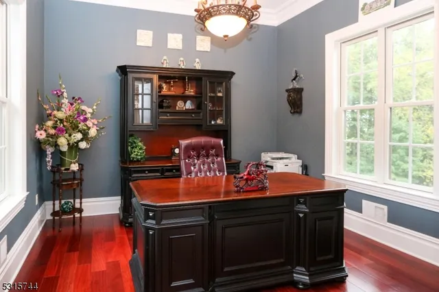 a table and a vase of flowers sitting on a table