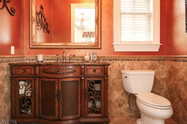 a bathroom with a toilet a sink and a window